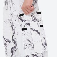 
                  
                    Breathable 3-layer ski jacket and suspender pants set - white marble print bib pants, for resort and backcountry days
                  
                