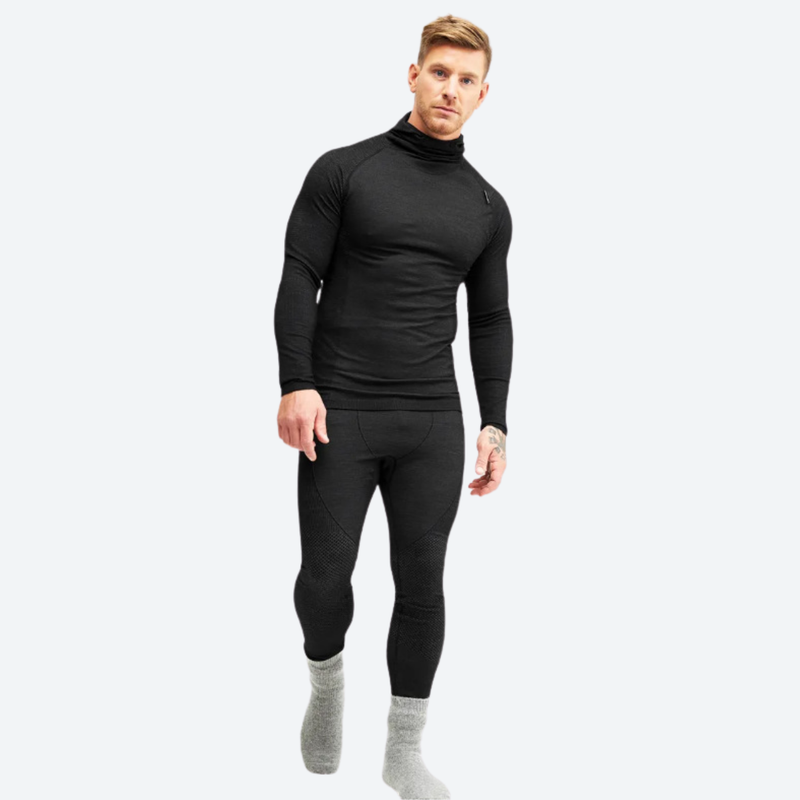 Warm merino wool baselayer suit with balaclava hood - black merino compression base layer suit on men, front walking view