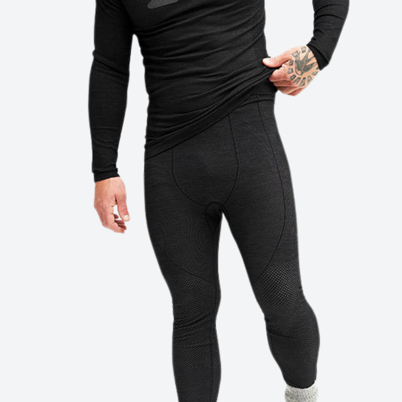 Breathable merino compression top and pants set - black merino compression base layer suit on men, front view pulling hem
