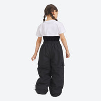 
                  
                    Kids breathable 2-layer ski suit - black kids snow pants with white tee, on-model back view, for family resort trips
                  
                