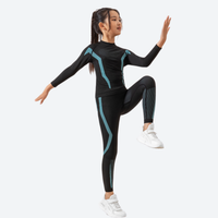 
                  
                    Kids' breathable compression top and pants set - black and teal kids compression base layer suit on girl, leg-raise pose view
                  
                