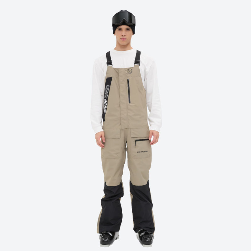 Men's waterproof 3L bib snow pants - tan bib snow pants with white top, full-body front view, for resort and backcountry days