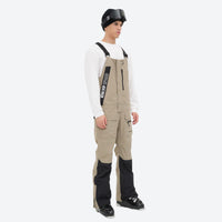 
                  
                    Men's bib snowboard pants with snow gaiters - tan bib snow pants with white top, for cold-weather winter sports
                  
                