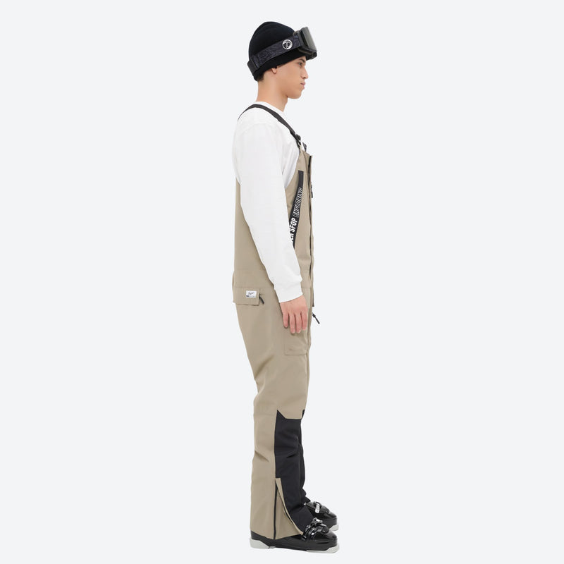 Men's waterproof 3L bib snow pants - tan bib snow pants with white top, on-model side view, for skiing and snowboarding