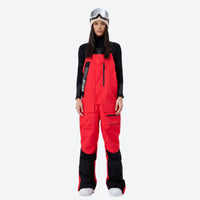 
                  
                    Women's breathable 3-layer suspender ski pants - red bib snow pants with black top, for resort and backcountry days
                  
                