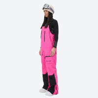 
                  
                    Women's bib snowboard pants with snow gaiters - pink bib snow pants with black top, for resort and backcountry days
                  
                
