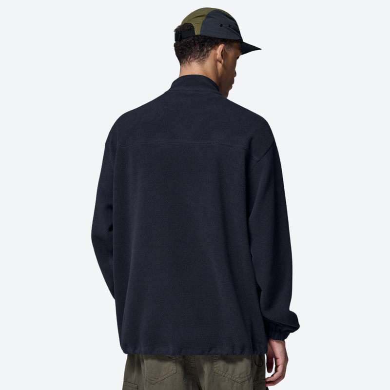 Women's soft lightweight fleece sweatshirt - navy half-zip fleece sweatshirt on men with cap, back standing view