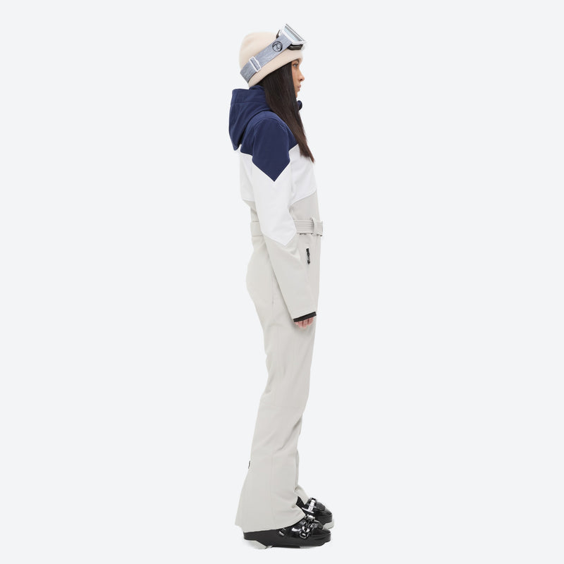 Women's waterproof one-piece snow suit with fur hood - cream navy colorblock one-piece snow suit, on-model side view