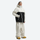 Men's colorblock ski anorak set - cream and black colorblock, on-model three-quarter front view, knee vents dump heat