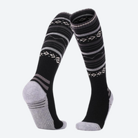 
                  
                    Compression merino wool ski socks 2.0 - fair-isle merino ski socks, pair view in black white, for skiing and snowboarding
                  
                
