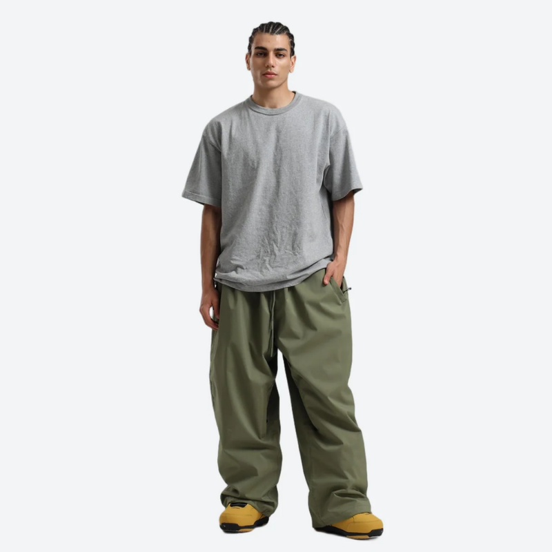 Men's waterproof 2L snow jacket and pants - olive green snow pants, on-model front view, for cold-weather winter sports