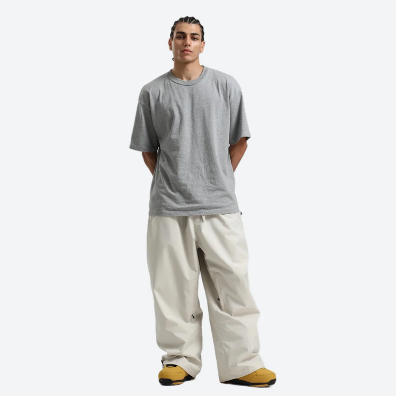 Men's breathable 2-layer snowboard jacket and pants - cream snow pants, on-model front view, for cold-weather winter sports