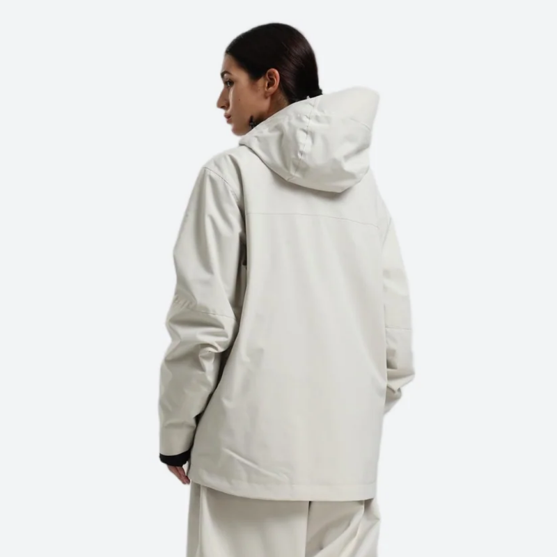 Women's breathable ski jacket with chest zip pockets - white jacket, on-model back view, for powder days and winter commute