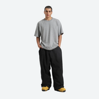 
                  
                    Men's breathable ski jacket with chest zip pockets - black snow pants with gray tee, for resort and street wear
                  
                