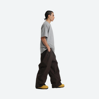 
                  
                    Men's waterproof 2L snow jacket and pants - coffee brown snow pants with gray tee, for cold-weather winter sports
                  
                