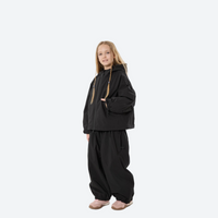 
                  
                    Youth 3-layer ski suit with bib pants - black, kids on-model three-quarter front view, for cold-weather winter outdoor fun
                  
                
