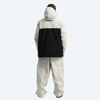 
                  
                    Men's colorblock ski anorak set - cream and black colorblock, on-model back hood view, knee vents dump heat
                  
                