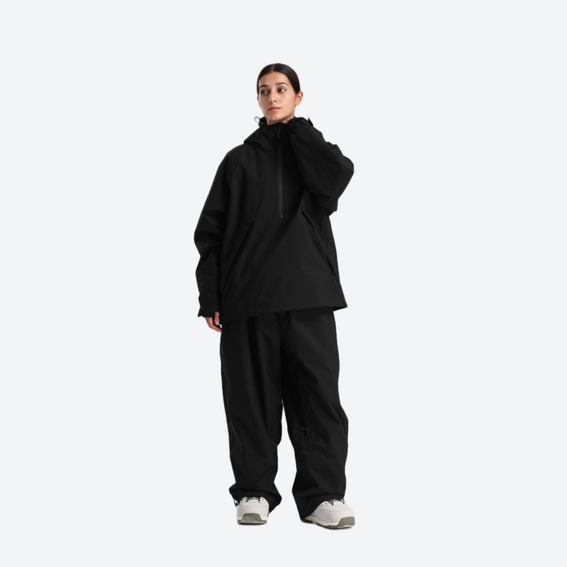 Women's waterproof 2L anorak snow jacket and pants - black anorak jacket with black snow pants, on-model back view