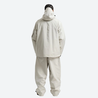 
                  
                    Men's colorblock ski pullover set - cream jacket with cream pants, on-model back hood view, for resort and street wear
                  
                