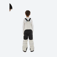 
                  
                    Youth 3-layer ski suit with bib pants - cream bib pants with black knee patches, for cold-weather winter outdoor fun
                  
                
