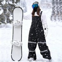 
                  
                    Breathable 3-layer suspender bibs with reflective trim - black bib pants with white top, for cold-weather winter sports
                  
                