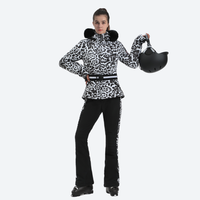 
                  
                    Women's slim ski jacket with belt and fur hood - leopard print slim fit ski jacket with fur collar, front view holding helmet
                  
                