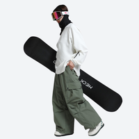 
                  
                    Women's adjustable snowboard pants with gaiters - sage green snow pants, for powder and piste riding
                  
                