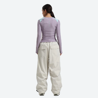 
                  
                    Women's 2-layer snowboard jacket and pants - white snow pants with lavender top, for powder days and winter commute
                  
                