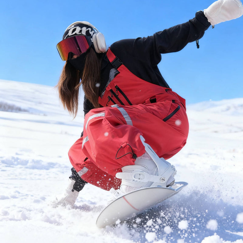 Unisex waterproof 3L bib snow pants - red bib pants, carving turn on snowy slope, for cold-weather winter sports