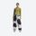 Women's 2-layer snowboard jacket and pants - olive green base layer top with cow print snow pants, on-model front view