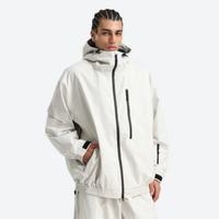
                  
                    Unisex snowboard jacket and pants set - white jacket, on-model three-quarter front view, for resort and street wear
                  
                
