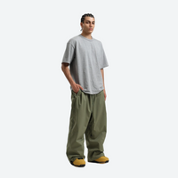 
                  
                    Men's breathable ski jacket with chest zip pockets - olive green snow pants with gray tee, for powder days and winter commute
                  
                