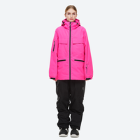 
                  
                    Women's 2-layer snowboard jacket and pants - pink jacket with black pants, for powder days and winter commute
                  
                