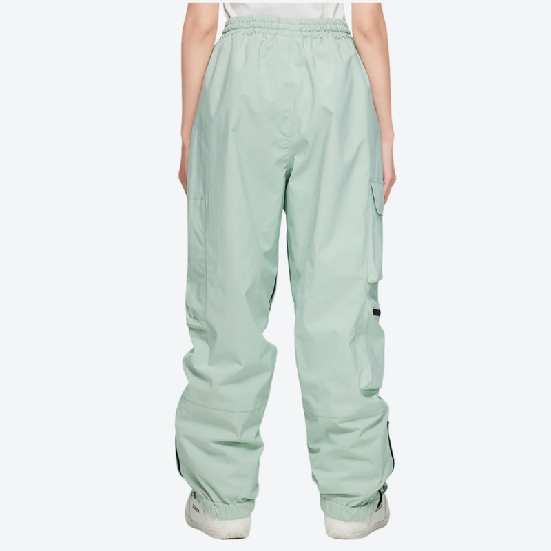 Women's breathable ski jacket in candy colors - mint green snow pants, on-model back view, for cold-weather winter sports