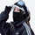 Breathable winter facemask worn with goggles - black facemask on women in white cap adjusting with goggles, worn adjust view