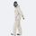 Breathable ski jacket and snow pants combo - cream, on-model walking three-quarter view, for resort and backcountry days