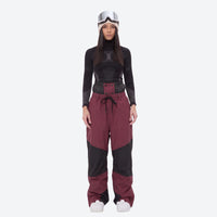 
                  
                    Waterproof snow jacket and pants set - women's wine colorblock pants with black base layer, for skiing and snowboarding
                  
                