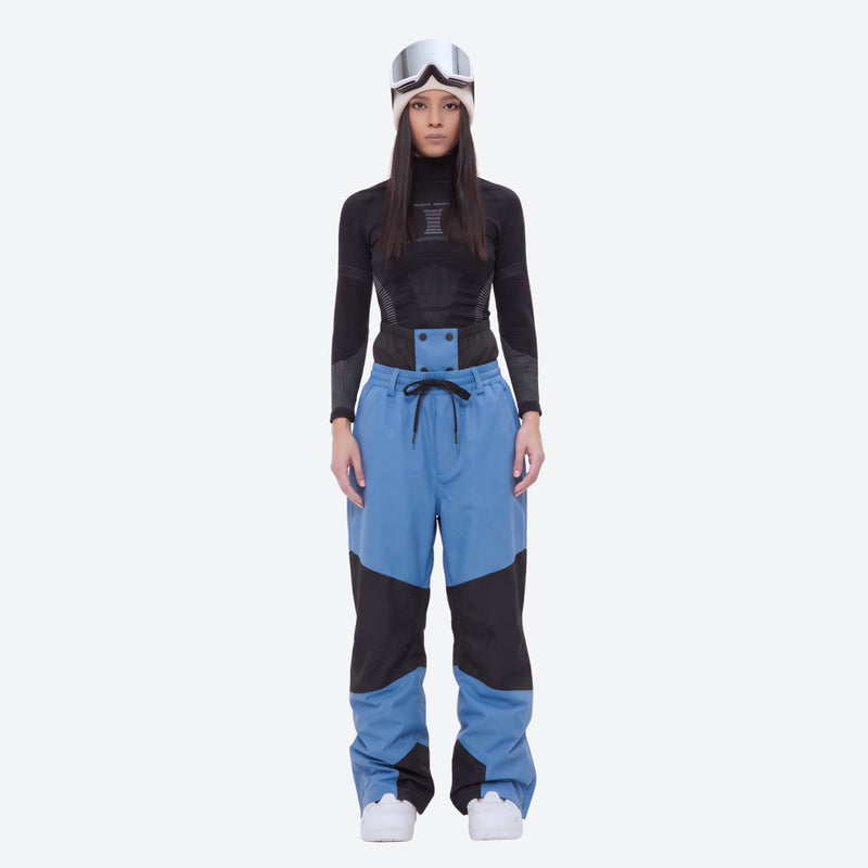 Colorblock snowboard jacket and pants set - women's blue colorblock pants with black base layer, on-model front view
