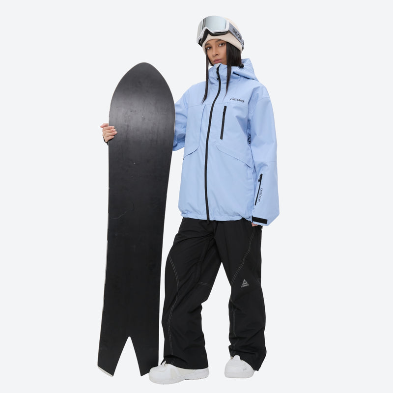 Breathable ski jacket and snow pants combo - sky blue, on-model front with upright snowboard, for powder and piste riding