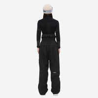 
                  
                    Breathable ski jacket and snow pants combo - women's black slim fit, on-model back view, for resort and backcountry days
                  
                