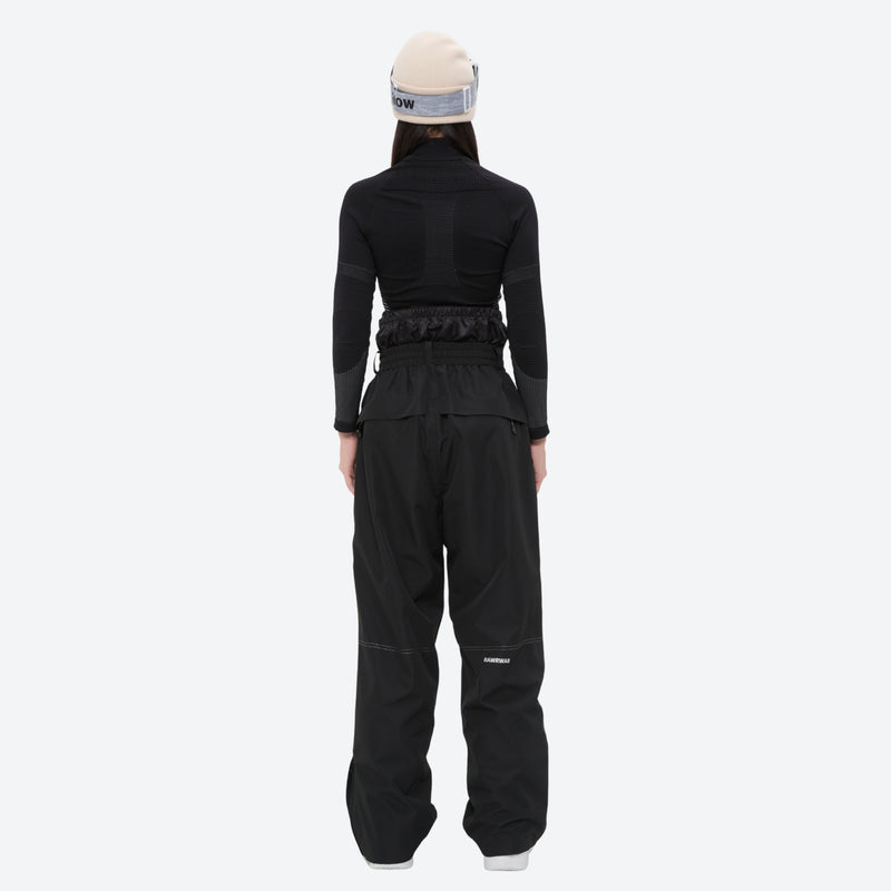 Breathable ski jacket and snow pants combo - women's black slim fit, on-model back view, for resort and backcountry days