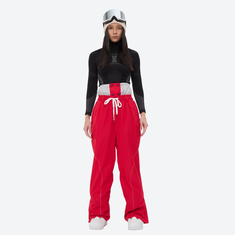 Breathable ski jacket and snow pants combo - women's red pants with black base layer, for cold-weather winter sports
