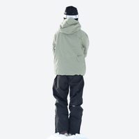 
                  
                    Breathable ski jacket and snow pants combo - sage green jacket with black pants, for cold-weather winter sports
                  
                