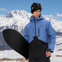 
                  
                    Breathable 2L snowboard jacket and pants - blue and black colorblock, for cold-weather winter sports
                  
                