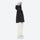 Women's waterproof 3L snow jacket and pants - black jacket with white pants, on-model side view, for powder and piste riding