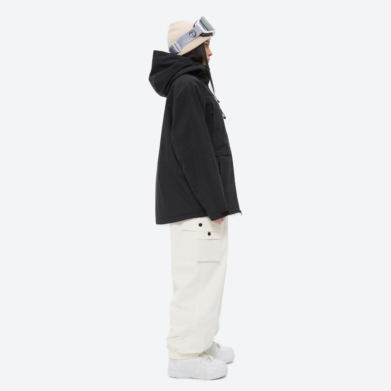 Women's waterproof 3L snow jacket and pants - black jacket with white pants, on-model side view, for powder and piste riding