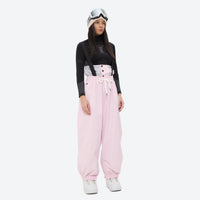 
                  
                    Women's 2-layer snowboard jacket and bibs - light pink bib pants with black top, for cold-weather winter sports
                  
                