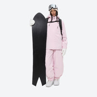 
                  
                    Women's 2-layer snowboard jacket and bibs - light pink jacket with light pink bib pants, for powder days and winter commute
                  
                