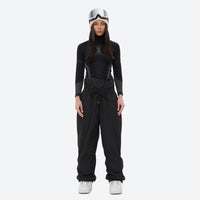
                  
                    Unisex 2-layer snowboard jacket and pants - black snow pants with black top, for powder days and winter commute
                  
                