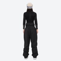 
                  
                    Breathable ski jacket with taped line details - black snow pants with black top, for cold-weather winter sports
                  
                